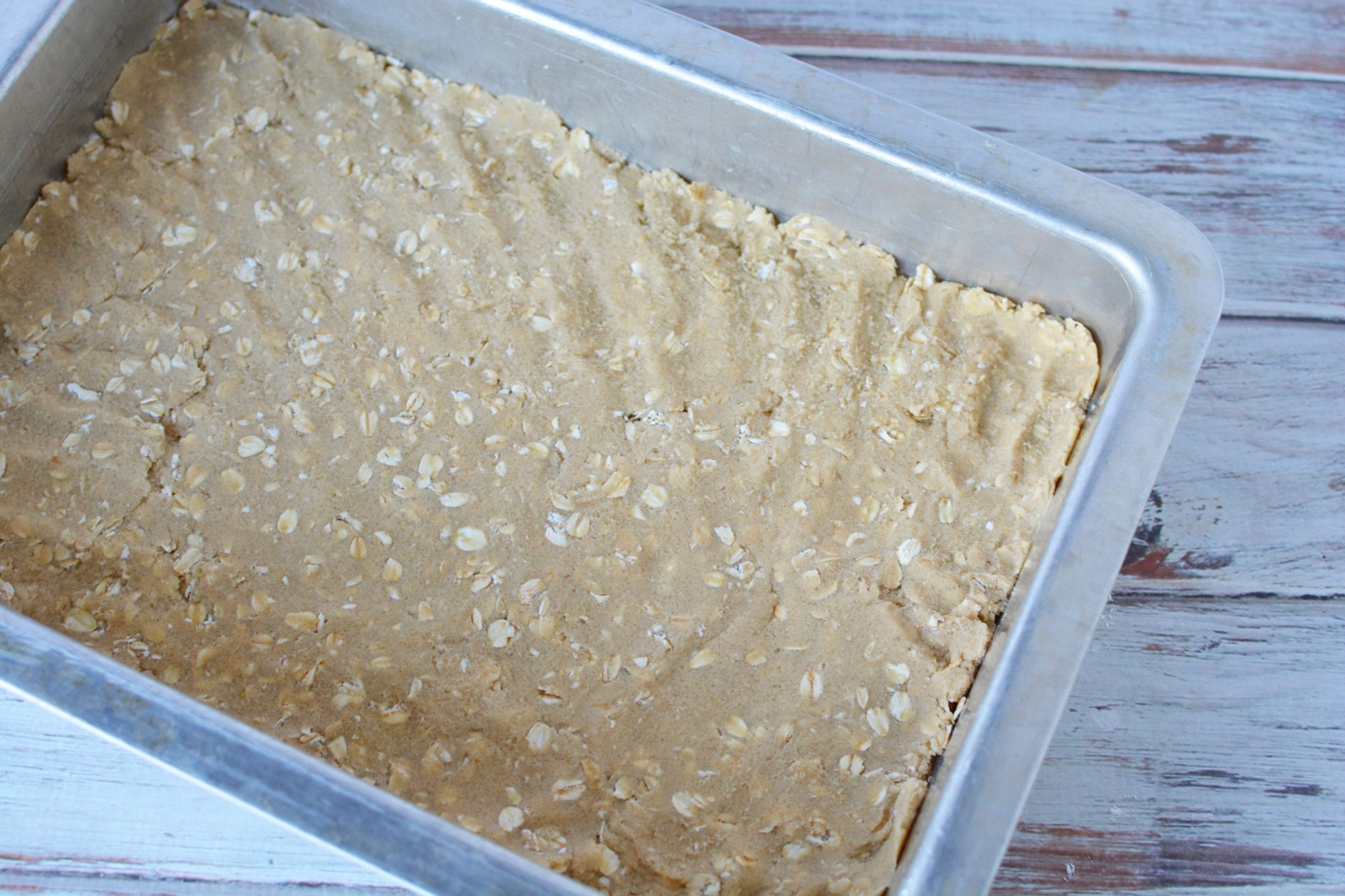 oatmeal mixture in the bottom of a 9x13 pan