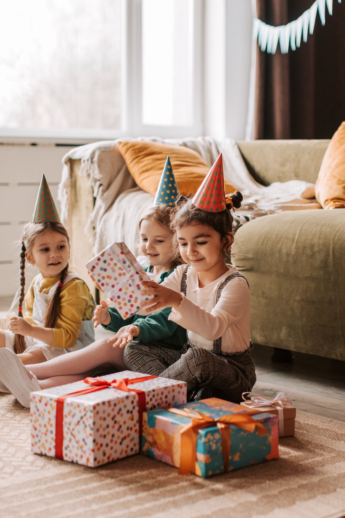 Children opening gifts at a birthday party