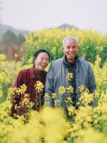 elderly couple in a field