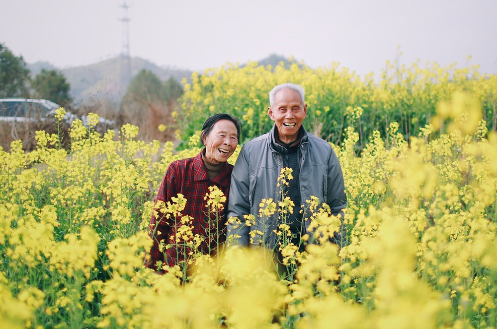 elderly couple in a field