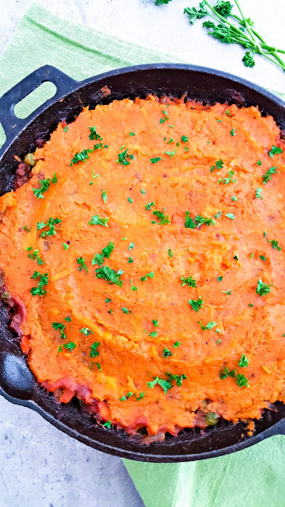 creamy mashed sweet potatoes in a cast iron skillet