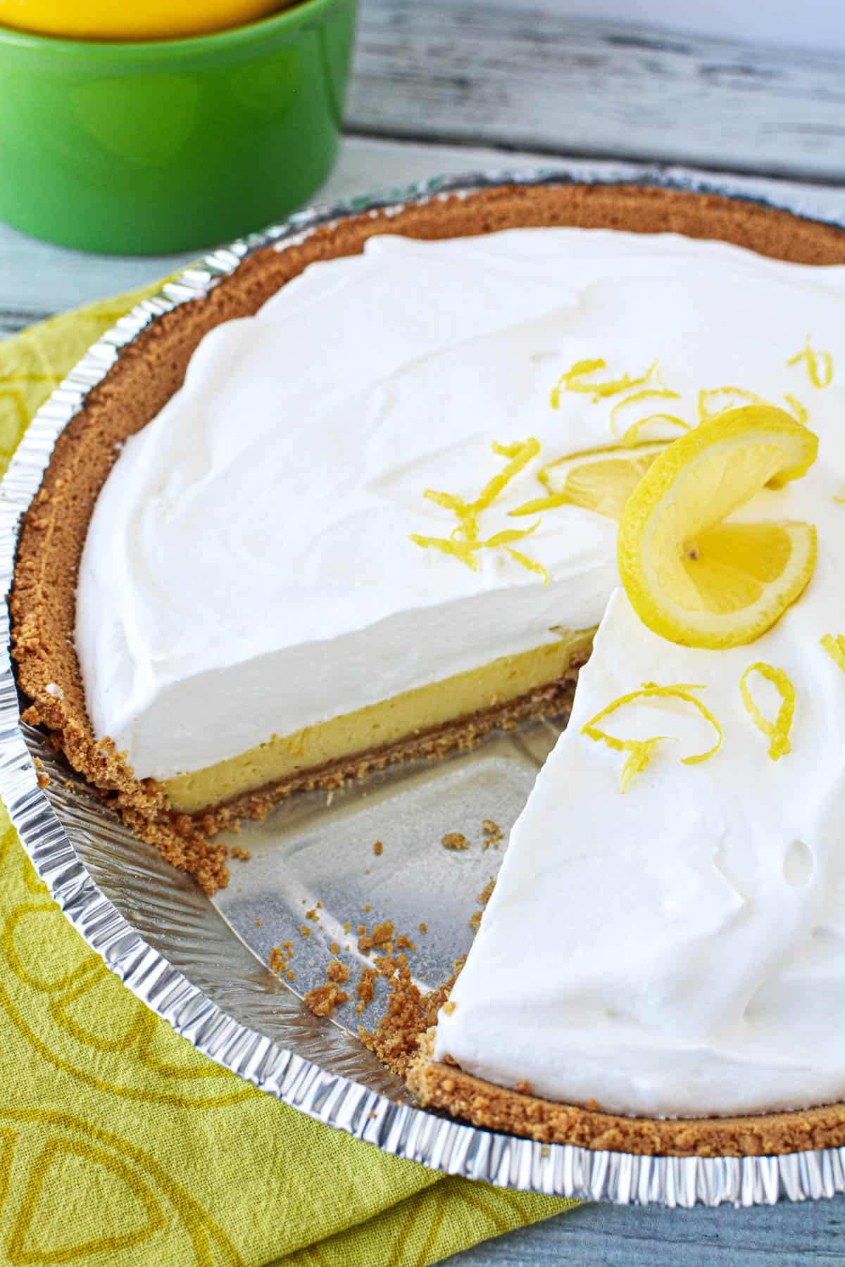 pie tin filled with lemon pie with whipped topping