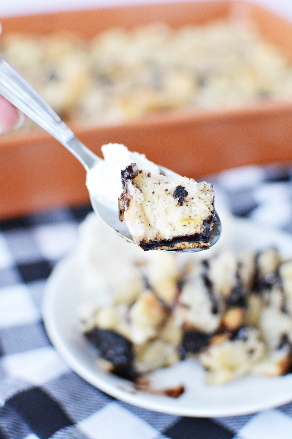 A spoon of cookies and cream bread pudding