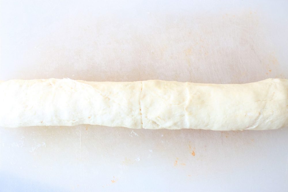 A tube of raw crescent roll dough