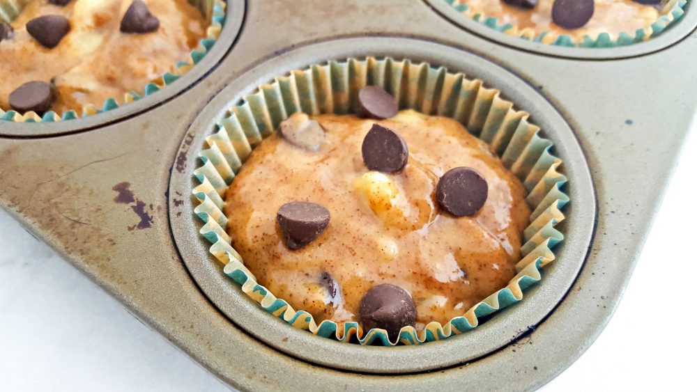 Banana almond butter muffins batter in a muffin cup