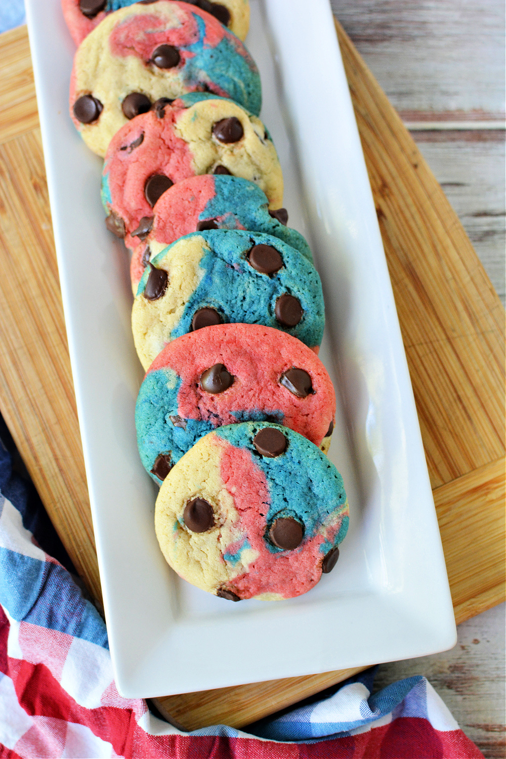 round cookies with red white and blue swirls and chocolate chips
