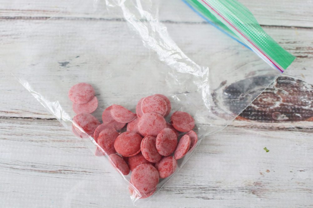 A bag of red candy melts