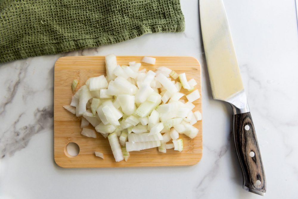 Diced white onions on a cutting board 