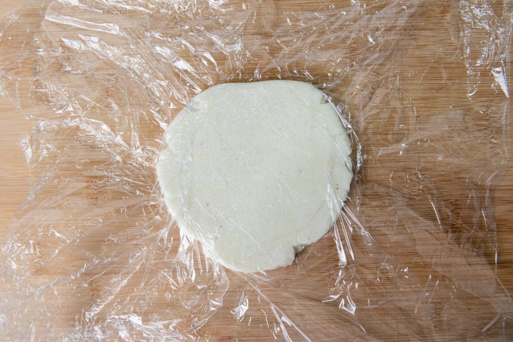 Flattening the arepa dough