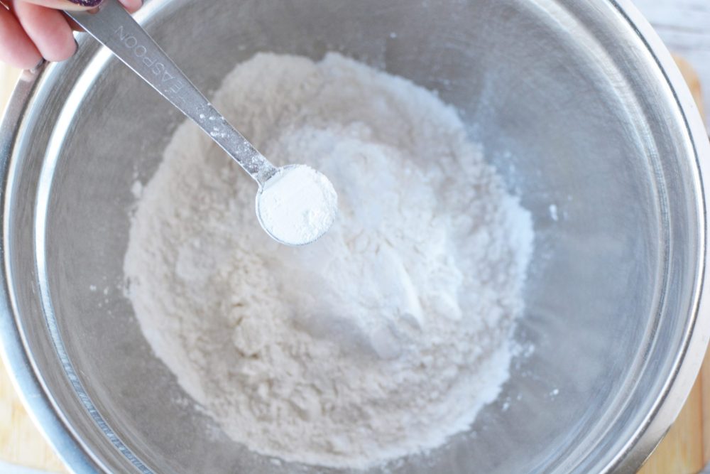 Mixing together flour and baking powder 