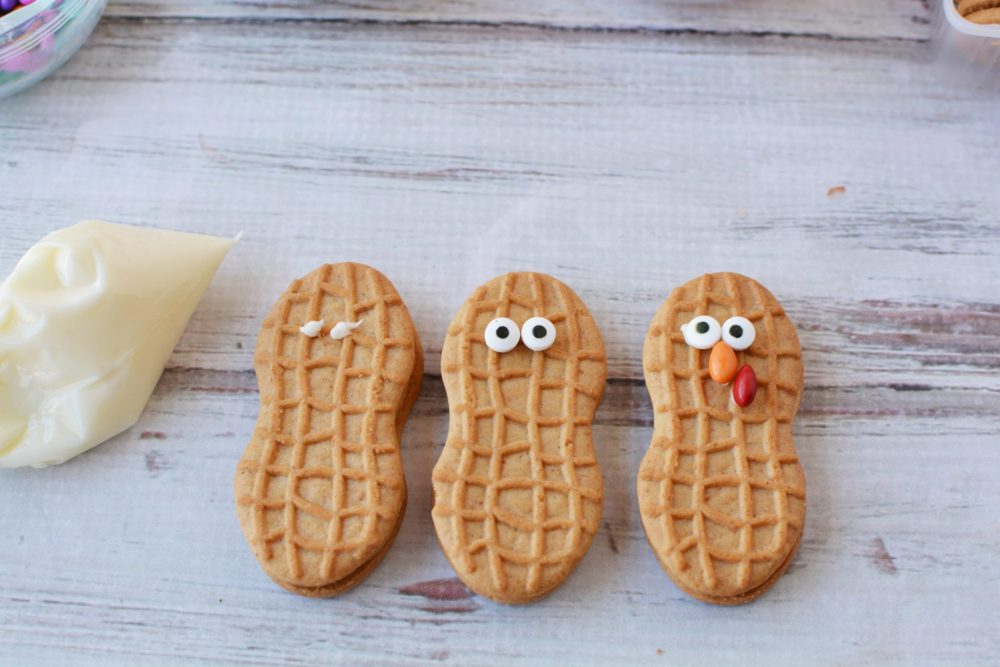 Decorating nutter butter cookies to look like turkeys 