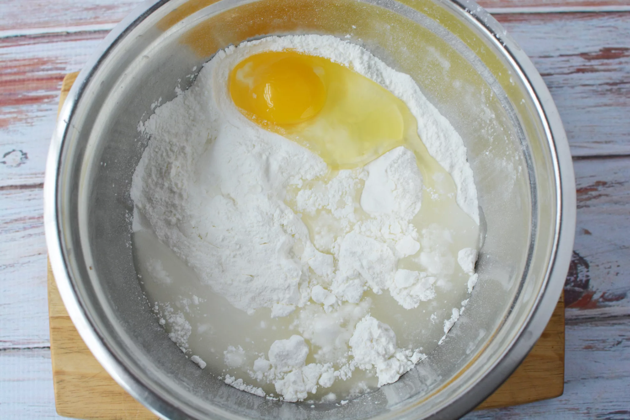 egg, cake mix and water in a stainless steel bowl