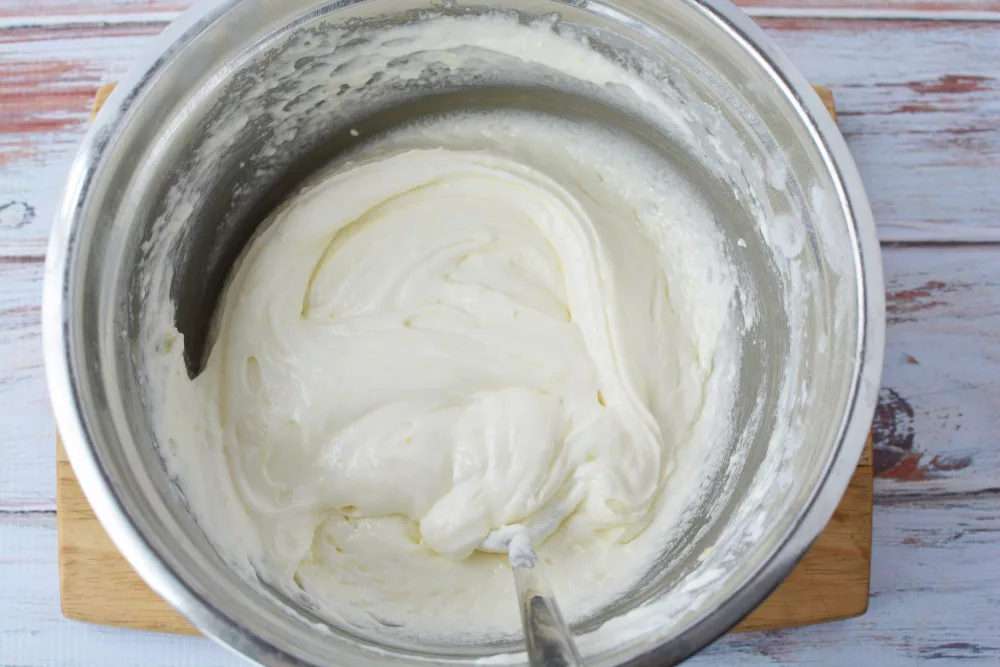 Prepare the dough by combining the cake mix, water and egg in a bowl until blended together completely.
