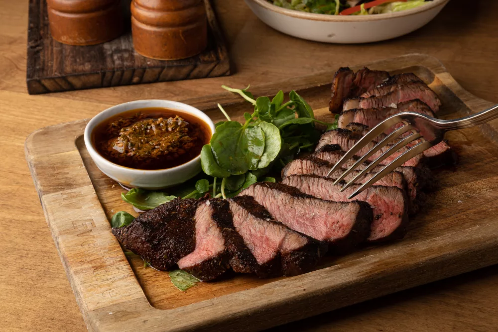 churrasco steak slices on a cutting board