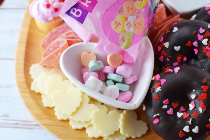 Then add the small items like the cheese hearts and candies.