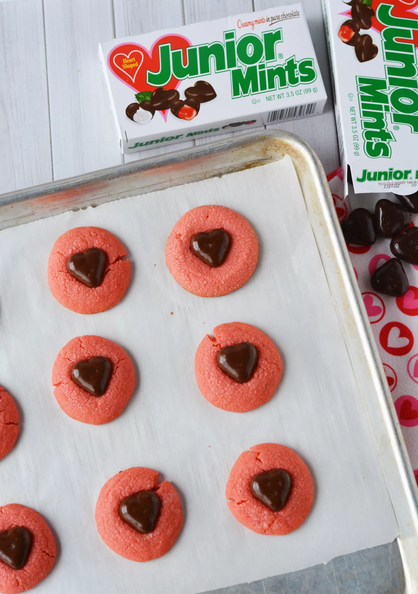 Junior Mint ingredients: Junior Mint box of candies and heart shaped pink cookies