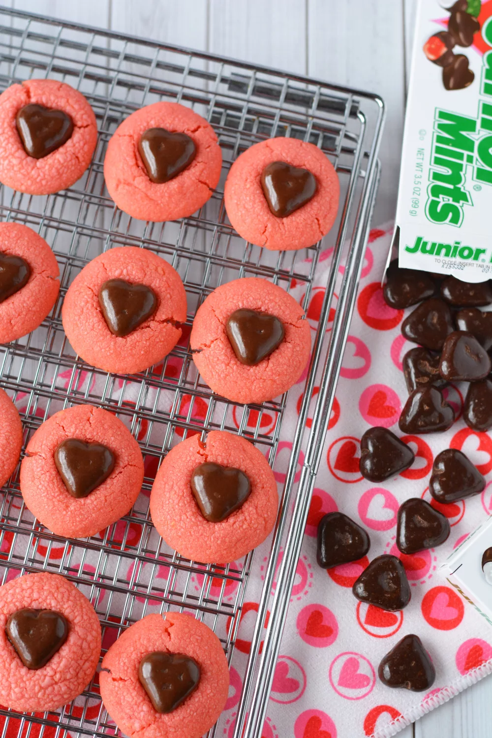 Junior Mint ingredients: Junior Mint box of candies and heart shaped pink cookies