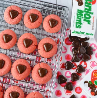 Junior Mint ingredients: Junior Mint box of candies and heart shaped pink cookies