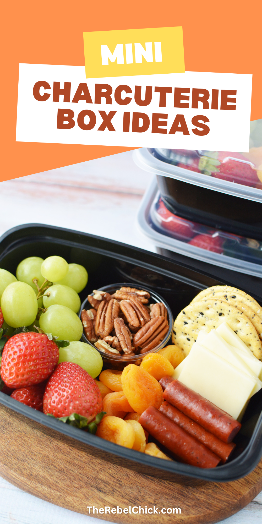 Mini Charcuterie Box filled with cheese, fresh fruit, crackers, pretzels, dried apricots, nuts and meats