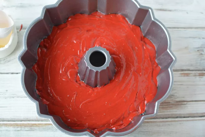 red velvet batter in a bundt pan