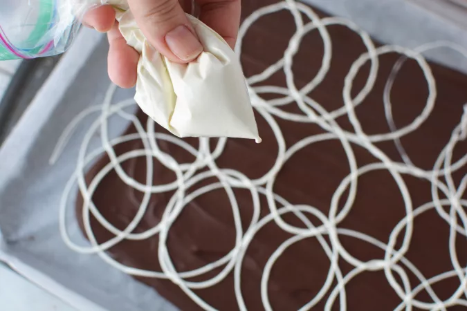 Drizzle and loop one color at a time on top of the best chocolate.
