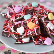 chocolate bark covered in valentines day sprinkles and conversation hearts