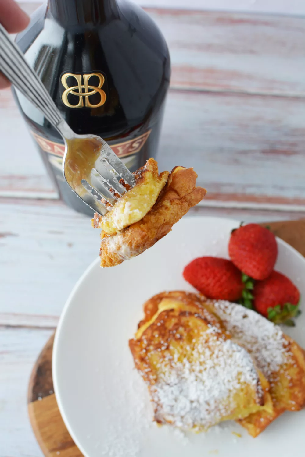 irish cream breakfast with powdered sugar and berries