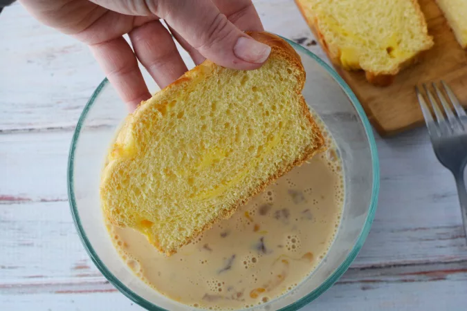 dipping bread in egg mixture
