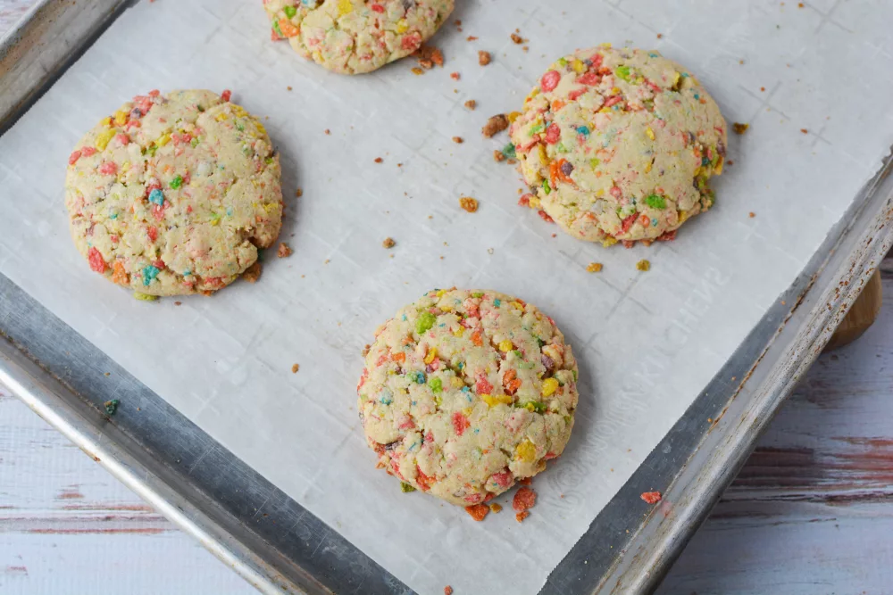 Fruity Pebbles Cookies on a cookie sheet lined with parchment paper