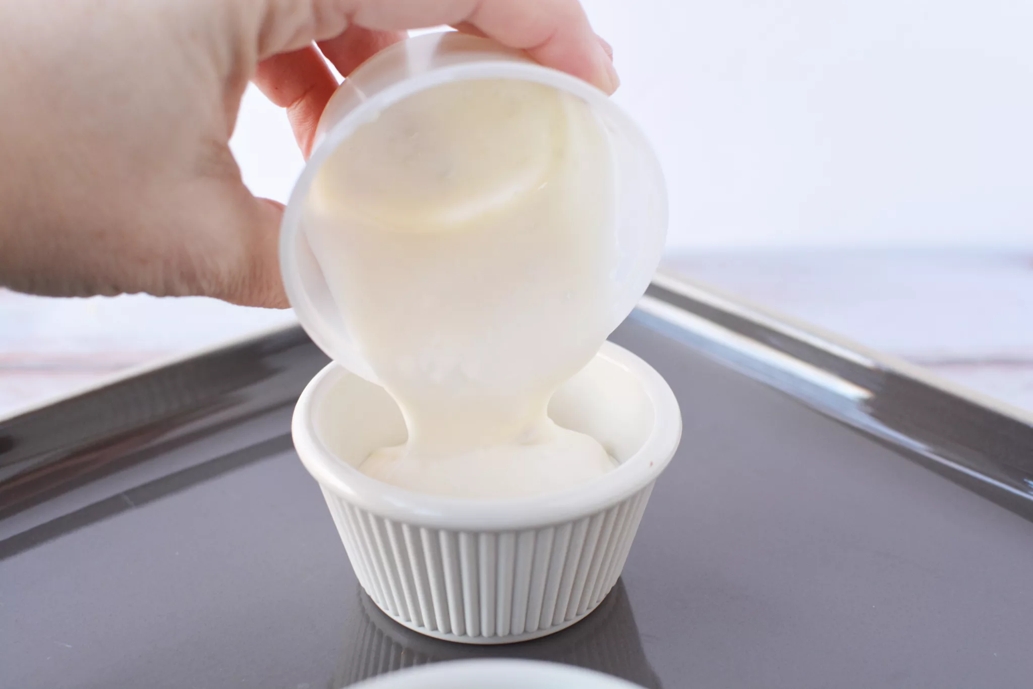 ranch dressing in a white ramekin bowl