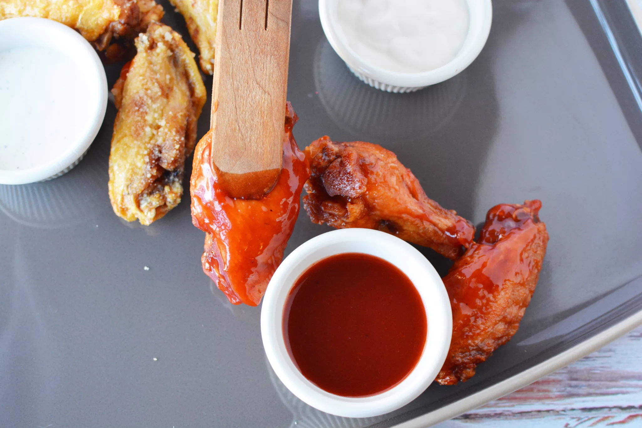 spicy hot wings on a charcuterie board