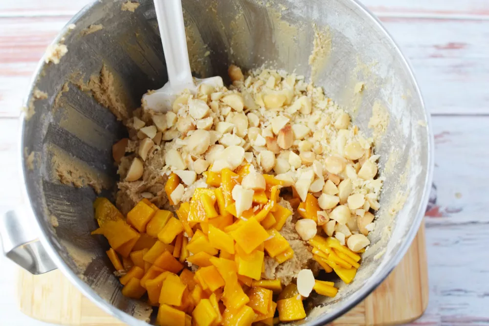 Now you are going to gently fold in the mangoes and your chopped macadamia nuts.