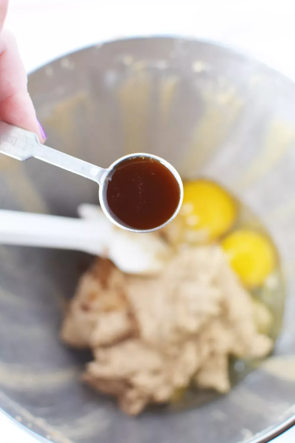 add in your eggs and the pure vanilla extract and beat them together well until they are completely combined.