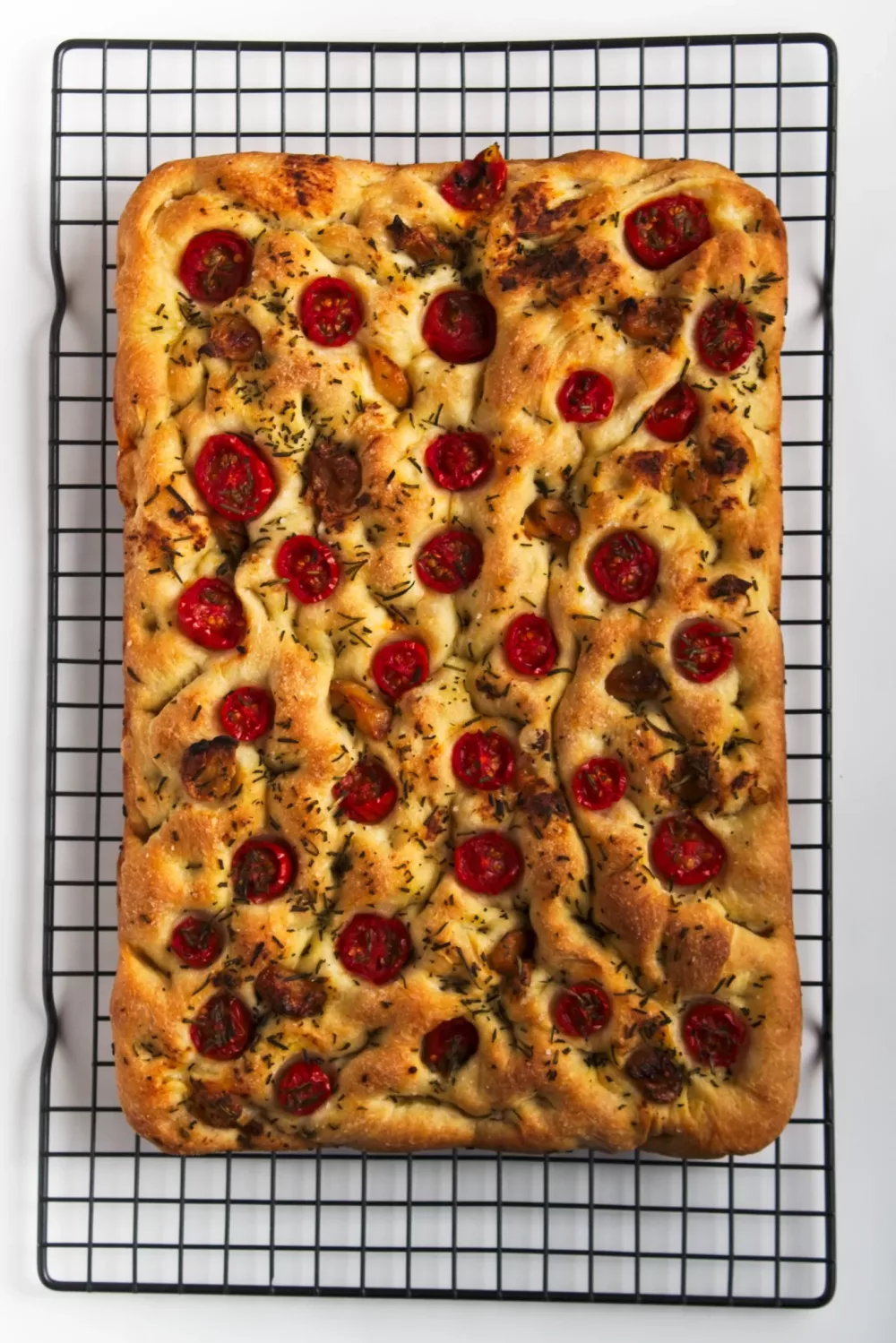 Roasted Garlic Focaccia resting on a cooling rack
