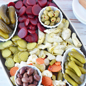 Pickle Charcuterie Board filled with pickled vegetables