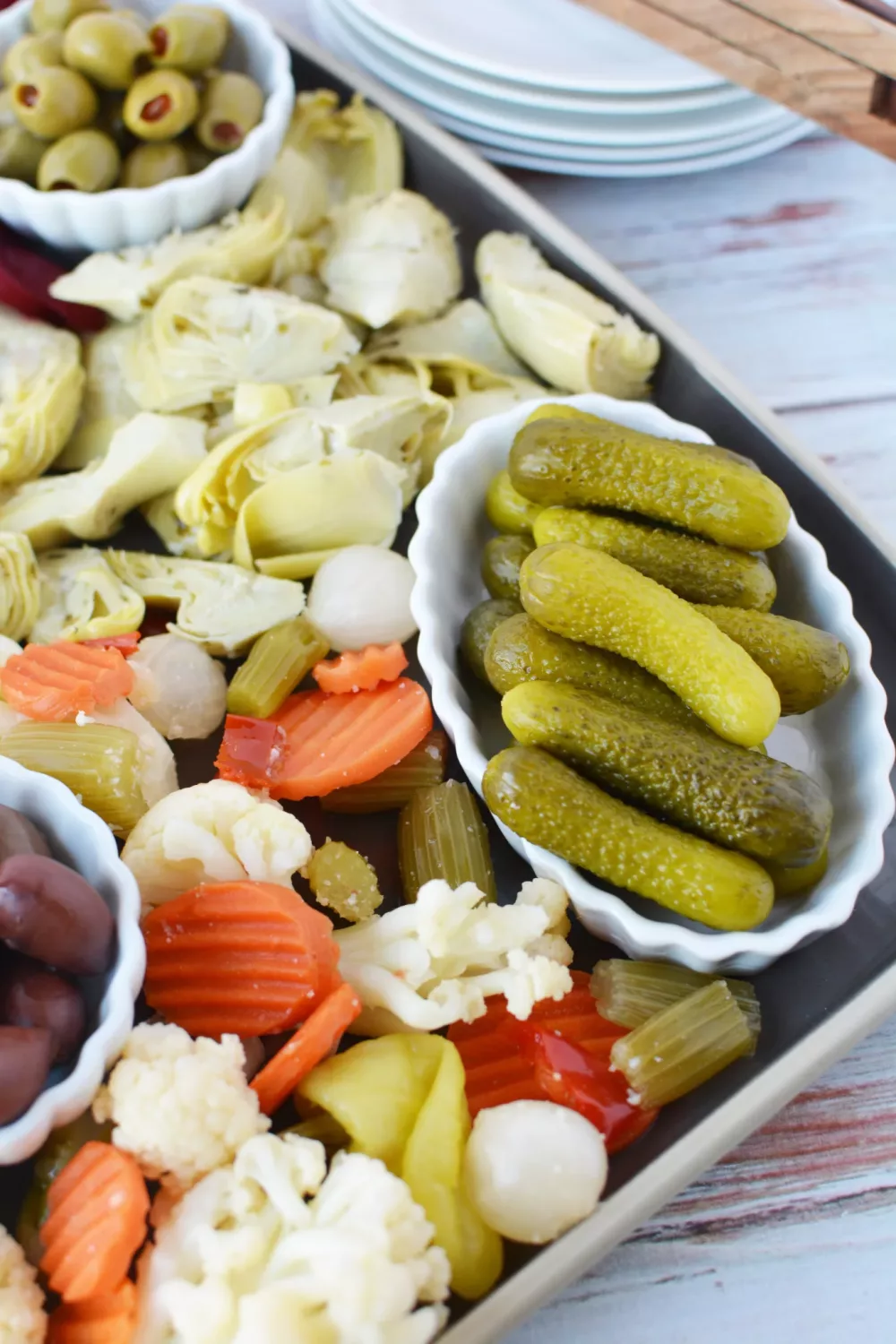 pickle charcuterie board filled with an assortment of pickled vegetables