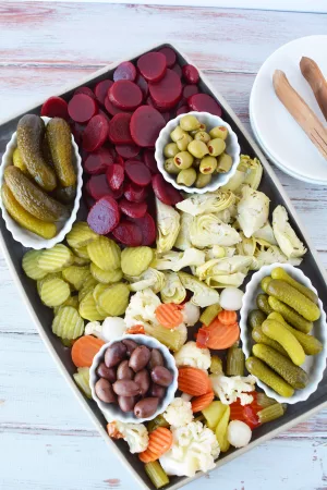 pickle charcuterie board filled with an assortment of pickled vegetables