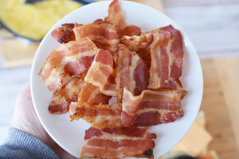 slices of cooked bacon a plate