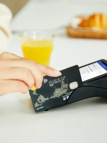 credit card being put through a credit card swiper