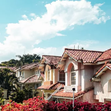 row of houses with a blue sky