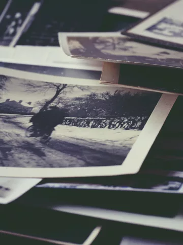 a stack of old family photos