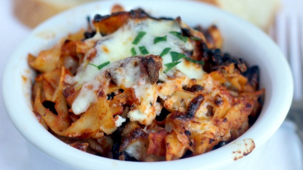 A bowl of easy lasagna pasta bake with plenty of cheese.