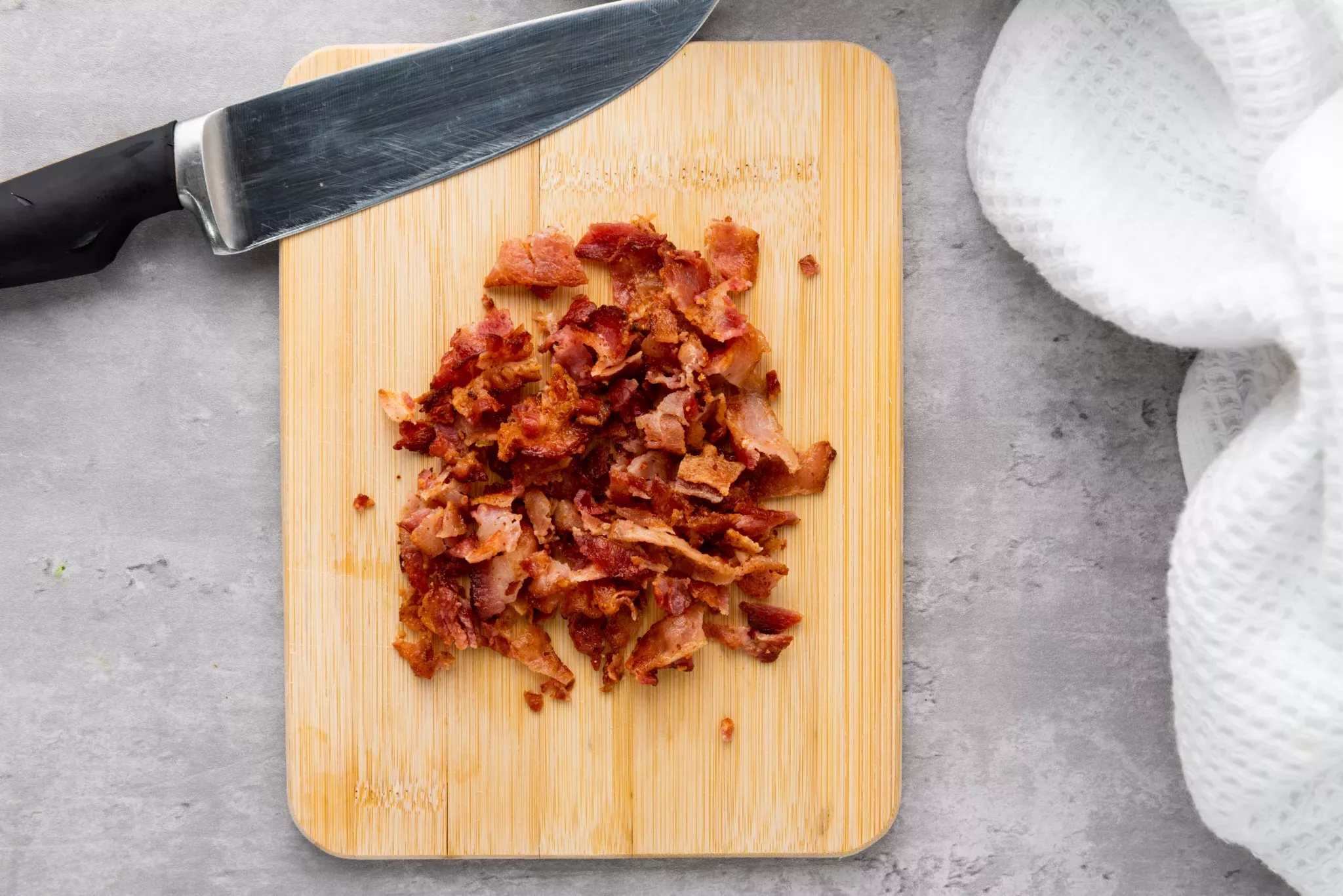 chopped bacon on a wooden board