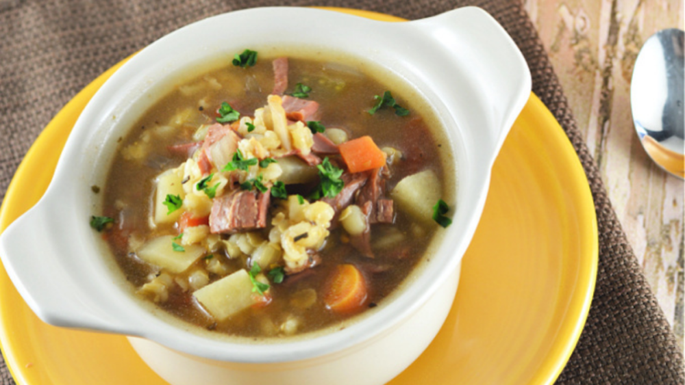 A bowl of hearty beef and barley soup.