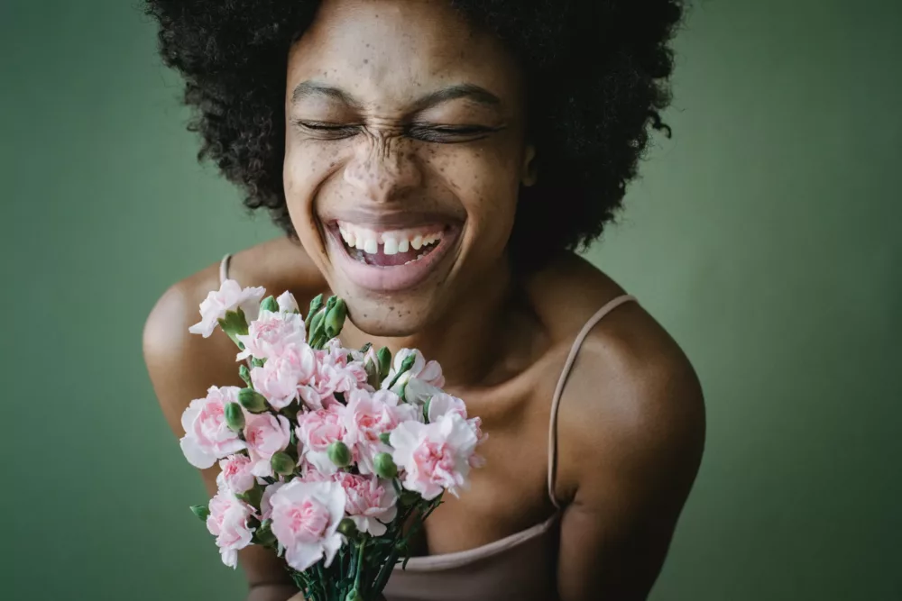 smiling woman with a bouquet of flowers