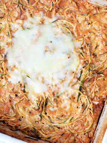 overhead shot of a casserole dish filled with spiralized Zucchini topped with melted cheese
