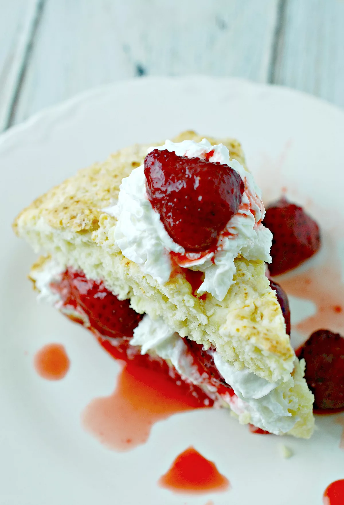 Closeup overhead shot of Strawberry Vanilla Cake on plate. 