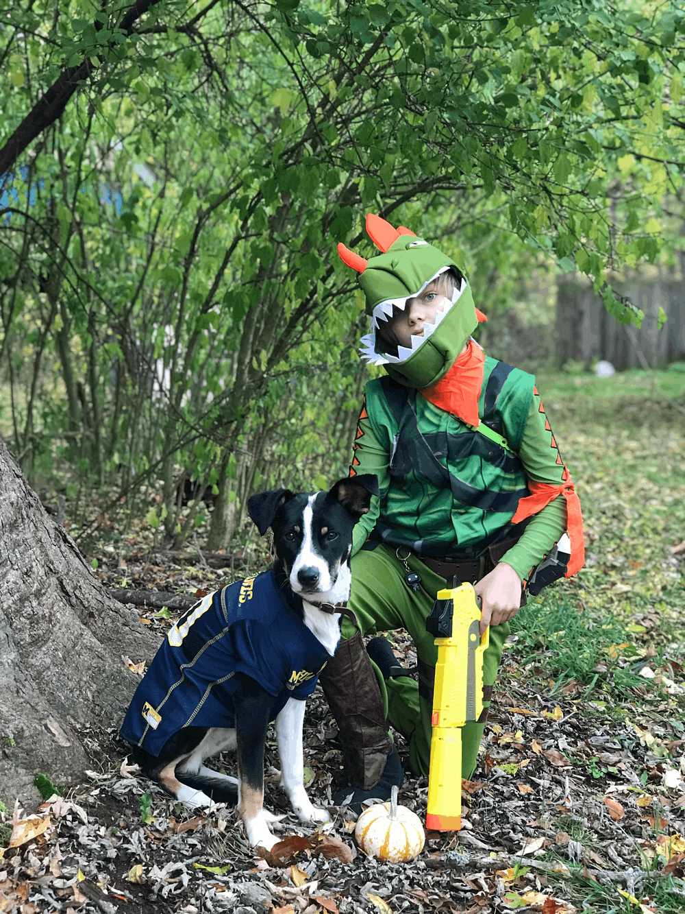 boy and his dog dressed in Halloween costumes