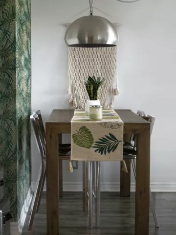 house plants and a plant table runnier on a kitchen table