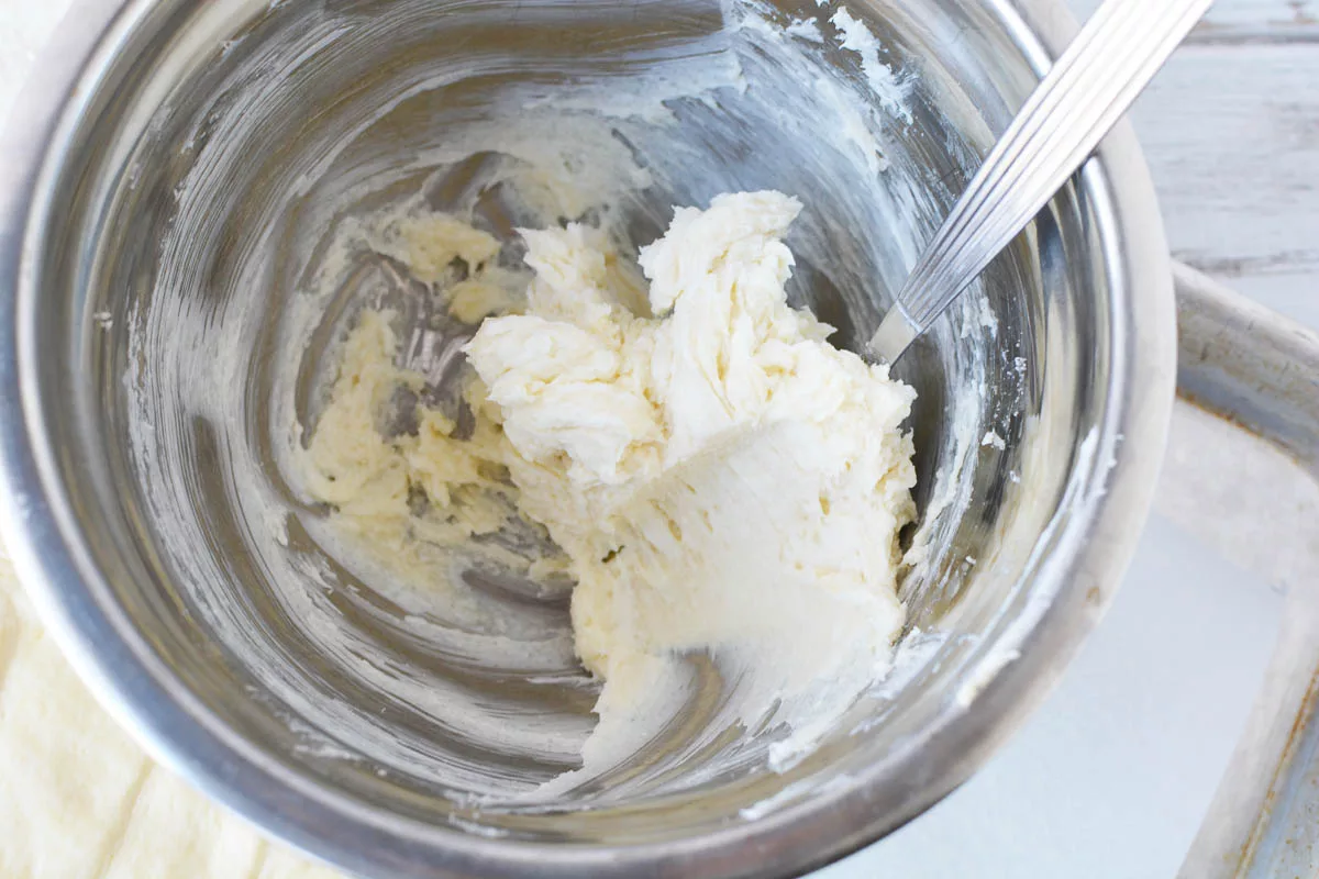 cream cheese, sugar and vanilla blended together in a bowl